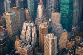 stock photo of sunset  - New York City Manhattan skyline aerial view with street and skyscrapers at sunset - JPG 