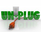 stock photo of cord  - The word Unplug in green letters with an orange electrical cord disconnected from the power outlet - JPG 
