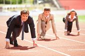 image of leadership  - Businessmen running on track racing at athletich stadium - JPG 