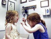 stock photo of medical doctors  - two little girls in a medical office playing doctor  - JPG 