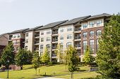 picture of buildings  - A large modern condominium or apartment building - JPG 