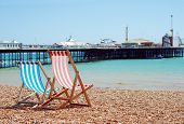 stock photo of beach  - deck chairs on the beach Brigton England on a sunny day - JPG 