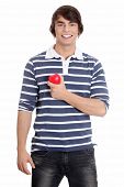 stock photo of bloodpressure  - Young man with heart - JPG 