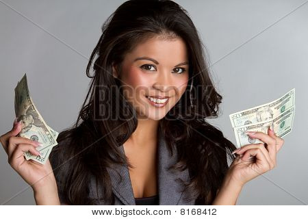 Picture or Photo of Beautiful happy smiling business woman holding money