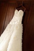 foto of wedding  - Beautiful wedding gown hanging before a ceremony - JPG 