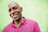 image of emotion  - Old people and emotions portrait of senior african american man looking and smiling at camera - JPG 