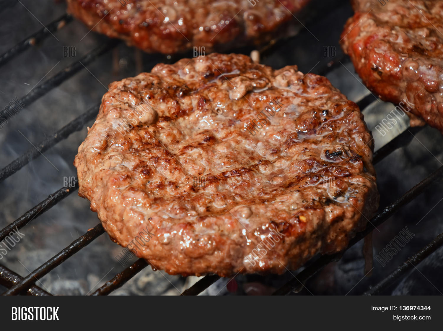 Meat Burgers For Hamburger Grilled On Grill Stock Photo & Stock Images