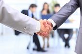 pic of handshake  - handshake isolated on business background - JPG 