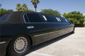 image of tint  - Black Stretch limousine waiting for guests to arrive - JPG 