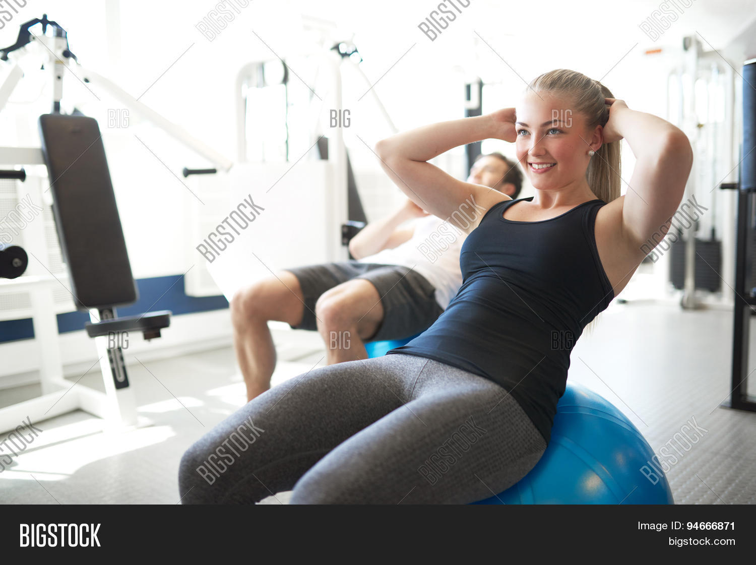 Fit Young Woman Doing Situps On Exercise Ball Stock Photo & Stock