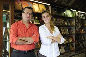 stock photo of partner  - proud family business partners owners of a small bookstore - JPG 