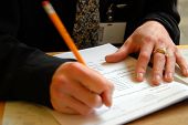stock photo of tickbox  - pencil in hand filling out a customer service form - JPG 