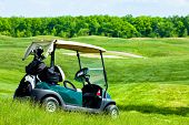 foto of golf  - green Golf club car at golf field - JPG 