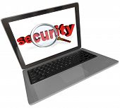 foto of security  - The word Security under a magnifying glass on a laptop computer screen to illustrate network or internet security in the digital age - JPG 