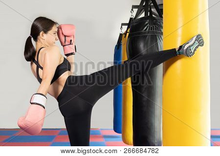 Poster: Female Boxer Hitting A Huge