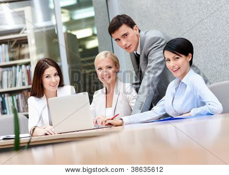Picture or Photo of Business people discuss something at the meeting at the modern office building. Success concept
