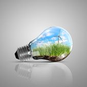 stock photo of nature  - Ecoloy illustration Lamp bulb with clean nature and renewable energy symbol inside - JPG 