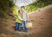 foto of pals  - Adorable Brother and Sister Children with Basket Hugging Outside - JPG 