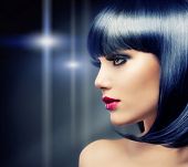 stock photo of health  - Beautiful Brunette Girl Portrait over Dark Background - JPG 