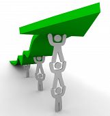 foto of teamwork  - Several figures team up to push up a green arrow symbolizing teamwork and growth - JPG 