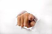 picture of points  - hand break through the white paper with finger pointing to the you - JPG 