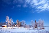 stock photo of hut  - Winter landscape with cabin hut at night in Kiruna Sweden at Night with star trail - JPG 