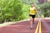 stock photo of fitness  - Runner man running on road training sprint for marathon run - JPG 