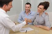 pic of meeting  - Financial advisor or lawyer giving advice to happy couple - JPG 