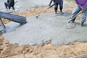 foto of construction  - Concrete pouring during commercial concreting floors of buildings in construction - JPG 