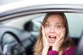 foto of transportation  - Shocked woman in a car - JPG 