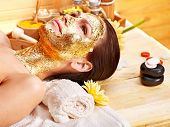 picture of facial  - Woman getting  gold facial mask - JPG 