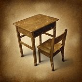 foto of time  - Old school desk symbol of education and learning in simpler times as a bigone old fashined era with vintage wooden student furniture on a dirty background - JPG 
