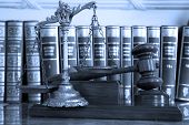 stock photo of blue  - Symbol of law and justice with books law and justice concept focus on the gavel blue tone - JPG 