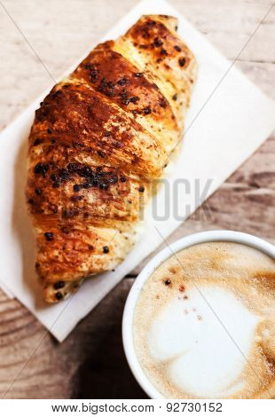 Coffee And Fresh Croissant For Breakfast On Rustic Wooden Table Top View Chocolate With Cappuccino Note Shallow Depth Of Field Poster Coffee And Fresh Croissant For Breakfast On Rustic Wooden Table Top View Chocolate With Cappuccino Note Shallow Depth Of Field Poster