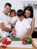 image of family  - Cheerful family cooking together in the kitchen - JPG 