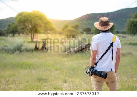 Poster: Young Man Traveler And Photographer