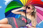 picture of glamorous  - glamorous girl in retro style by color umbrella on the beach - JPG 