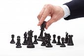 stock photo of leadership  - Business man moving chess figure - JPG 