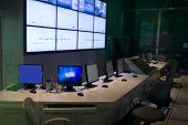 picture of security  - an command center with big screens and workstation - JPG 