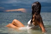 pic of sunset  - Beautiful brunette in the water at sunset - JPG 