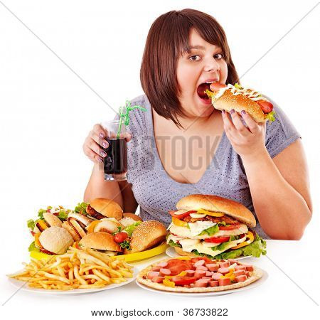 Picture or Photo of Overweight woman eating fast food.