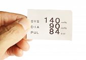 foto of pressure  - Hand hold report paper from blood pressure measure machine - JPG 