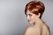 foto of health  - beautiful young woman with red hair wearing short pixie crop hairstyle on studio background - JPG 