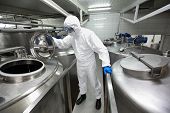 stock photo of food  - specialist in protective uniform - JPG 