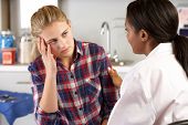 picture of md  - Teenage Girl Visits Doctor - JPG 