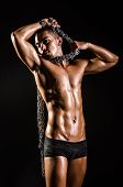 foto of man  - Muscular man with chain on black background - JPG 
