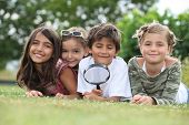 foto of watch  - Kids playing with magnifying glass in park - JPG 