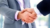 picture of meeting  - handshake isolated on blue background - JPG 