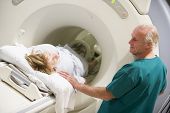 picture of medical doctors  - Doctor With Patient As They Prepare For A Computerized Axial Tomography  - JPG 