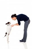 picture of dog  - pretty woman training a pet dog isolated on white background - JPG 